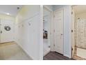 A hallway with light colored walls, wood flooring, and access to other rooms at 565 White River Dr. # 10-E, Myrtle Beach, SC 29579