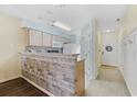 Kitchen with granite countertops, light wood cabinets, and a breakfast bar at 565 White River Dr. # 10-E, Myrtle Beach, SC 29579