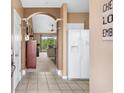 Bright entryway with tile flooring, view into living room and kitchen at 5801 Oyster Catcher Dr. # 532, North Myrtle Beach, SC 29582