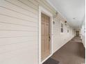 Building hallway with light brown walls and carpeted floor at 5801 Oyster Catcher Dr. # 532, North Myrtle Beach, SC 29582