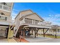 Inviting beach home featuring a large deck with ample parking underneath at 6001- P04 S Kings Highway, Myrtle Beach, SC 29575