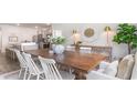 Farmhouse dining room with large wooden table and seating for six at 679 Choctaw Dr., Conway, SC 29526