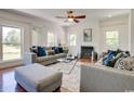 Comfortable living room with contemporary furniture, hardwood floors, fireplace, and plenty of natural light at 899 Kinlaw Ln., Conway, SC 29527