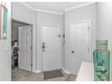 Bright entryway with white door and access to multiple rooms at 9772 Leyland Dr. # 10, Myrtle Beach, SC 29572