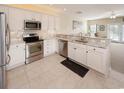 Bright kitchen features stainless steel appliances and granite countertops at 114-A 11Th Ave. S, Surfside Beach, SC 29575