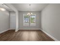 Spacious dining room with hardwood floors, large windows, and natural light at 1212 Nw Calabash Station Blvd., Calabash, NC 28467