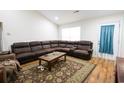 Spacious living room with a large sectional sofa and wood floors at 132 Blue Jacket Dr., Galivants Ferry, SC 29544
