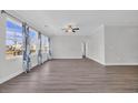 Spacious living room with large windows, allowing for plenty of natural light and backyard views at 1357 Jolly Roger Dr., North Myrtle Beach, SC 29582