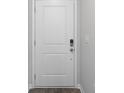 White front door with keyless entry and wood flooring at 157 Hoffman Park Dr. # 80, Myrtle Beach, SC 29588