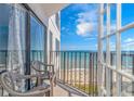 Ocean view from condo balcony with chairs, offering stunning beach and seascape at 1605 S Ocean Blvd. # 1113, Myrtle Beach, SC 29577