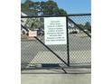 Deer Creek community information sign with office hours and emergency contact at 1650 Deer Creek Rd., Surfside Beach, SC 29575
