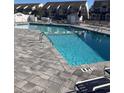 Community swimming pool with lounge chairs at 1650 Deer Creek Rd., Surfside Beach, SC 29575