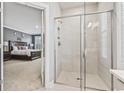 Glass enclosed shower with gray tile and built-in shelving at 208 Switch Grass Ct., Myrtle Beach, SC 29579