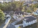 An aerial view of a home in a well-planned community surrounded by lush greenery and a lake at 2113 Clematis Ct., Myrtle Beach, SC 29579