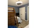 Blue bedroom with bunk bed, dresser, and closet at 4714 Woodland St., North Myrtle Beach, SC 29582