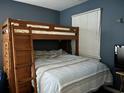 Bedroom with a bunk bed, dresser, and light blue bedding at 4714 Woodland St., North Myrtle Beach, SC 29582