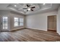 Spacious living room featuring wood-look floors and a coffered ceiling at 4983 Dupont Rd., Conway, SC 29526