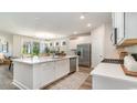 Modern kitchen with white cabinets, island, and stainless steel appliances at 500 Slaty Dr., Myrtle Beach, SC 29588