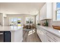 Open kitchen with island, white cabinets, and breakfast nook at 504 Slaty Dr., Myrtle Beach, SC 29588
