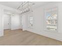 Bright dining room with hardwood floors and a stylish chandelier at 540 Ayrhill Loop, Myrtle Beach, SC 29588