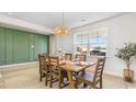 Bright dining room with a farmhouse table and green accent wall at 551 Slaty Dr., Myrtle Beach, SC 29588