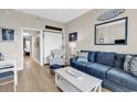 Living area showcasing hardwood floors and access to hallway at 601 Retreat Beach Circle # 124, Pawleys Island, SC 29585