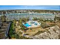 Resort-style pool and building aerial view at 601 Retreat Beach Circle # 328, Litchfield, SC 29585