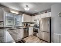 Modern kitchen with granite counters and stainless steel appliances at 612 S Ocean Blvd. # 104A, Surfside Beach, SC 29575