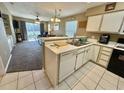 Kitchen features white cabinets, appliances, and tile flooring at 636 Waterway Village Blvd. # 17C, Myrtle Beach, SC 29579