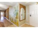 Hallway featuring gorgeous mural with beach scene and mirror with ornate carvings at 8560 Queensway Blvd. # 1210, Myrtle Beach, SC 29572