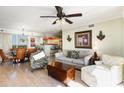 Inviting living room with cozy furniture and a view of the kitchen at 8560 Queensway Blvd. # 1210, Myrtle Beach, SC 29572