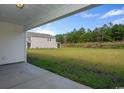Spacious backyard with large grassy area and privacy at 920 Belle Dr., North Myrtle Beach, SC 29582