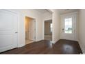 Hardwood floor foyer with powder room and views to living room at 920 Belle Dr., North Myrtle Beach, SC 29582