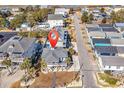 Aerial view of property location, beach house among other homes at 923 N Waccamaw Dr., Garden City Beach, SC 29576