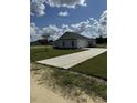Newly built home showcasing a large yard and concrete driveway at Tbb14 Casey Dr., Green Sea, SC 29545