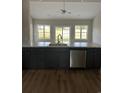 Modern kitchen with dark cabinets, island, and stainless steel appliances at Tbd 13 Casey Dr., Green Sea, SC 29545