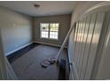 Unfurnished bedroom with new flooring and a large window at Tbd 14 Casey Dr., Green Sea, SC 29545