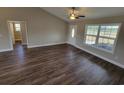 Open living room with hardwood floors and access to other rooms at Tbd10 Casey Dr., Green Sea, SC 29545