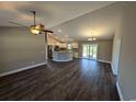 Spacious living room featuring dark laminate floors and a kitchen island at Tbd11 Casey Dr., Green Sea, SC 29545