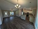 Open concept living and kitchen area with laminate floors and recessed lighting at Tbd11 Casey Dr., Green Sea, SC 29545