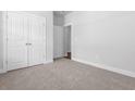 Spacious bedroom features plush carpeting, double closets, and access to the rest of the house at 1099 Nw Forest Bend Dr., Calabash, NC 28467