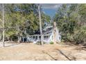House exterior, showcasing a front porch and chimney at 117 George Washington Trail, Georgetown, SC 29440