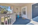 Inviting entryway with patio furniture and view of surrounding landscape at 1870 Auburn Ln. # 21J, Surfside Beach, SC 29575