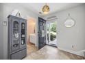 Bright entryway with tiled floor, coat closet, and half bath at 202 Junco Circle, Longs, SC 29568