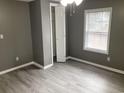Recently renovated bedroom featuring fresh paint, a ceiling fan, and an opened closet at 206 W Pine St., Johnsonville, SC 29555