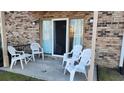 Small patio with white chairs and access to the interior at 210 Double Eagle Dr. # H-1, Surfside Beach, SC 29575