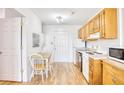 Condo kitchen with light wood cabinets and small dining area at 2710 S Ocean Blvd. # 207 A, Myrtle Beach, SC 29577