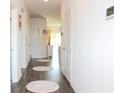 Bright hallway with hardwood floors and access to other rooms at 3528 Bells Lake Circle # 3528, Longs, SC 29568