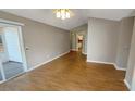 Living room with hardwood floors and access to kitchen at 3634 Farmington Pl., Myrtle Beach, SC 29579