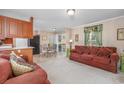Open living space with a comfortable couch and access to the kitchen at 3790 Woodridge Circle, Little River, SC 29566